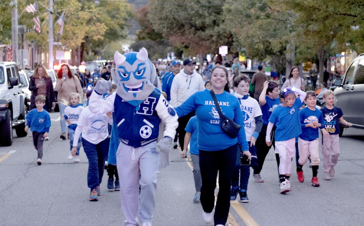 The Haldane Blue Devil and Haldane math teacher Kristen Peparo lead the charge up Main Street to the stands before the Homecoming football game on Oct. 18.