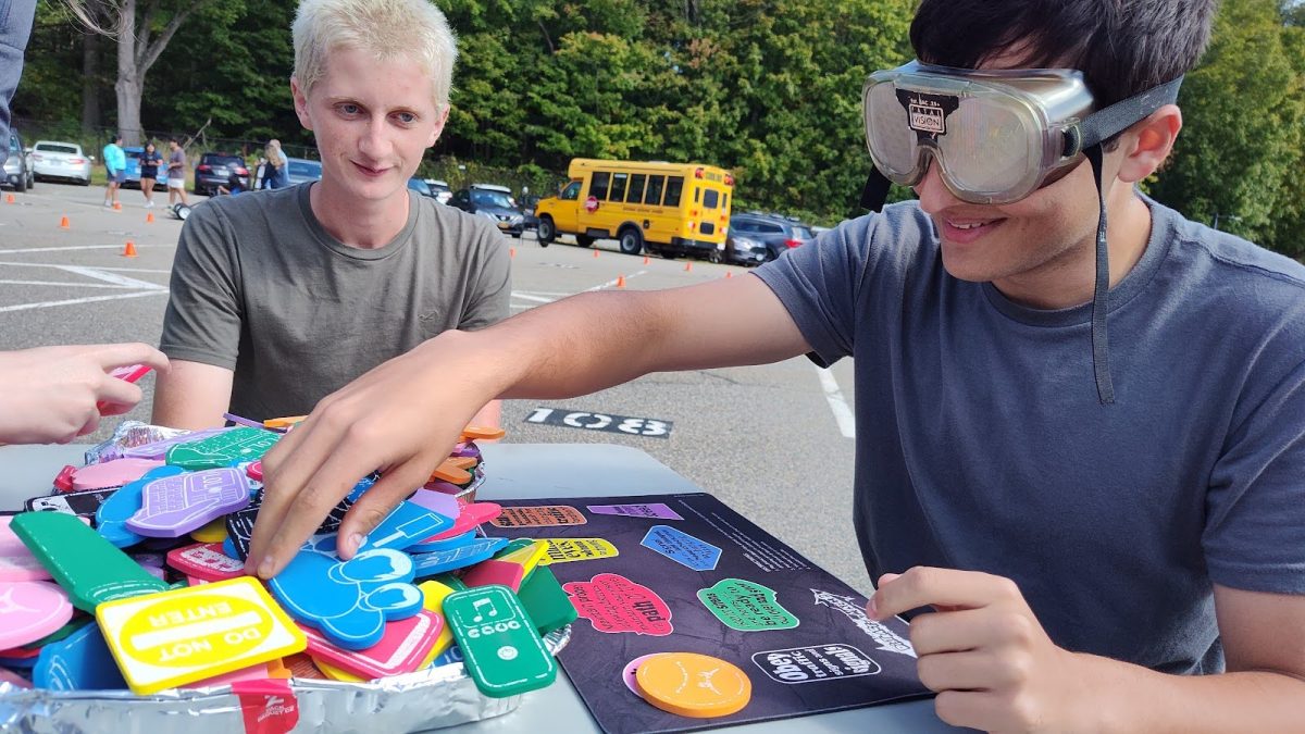 Senior Marc Firpo attempts a drunk distraction game while senior Owin Cuite looks on.