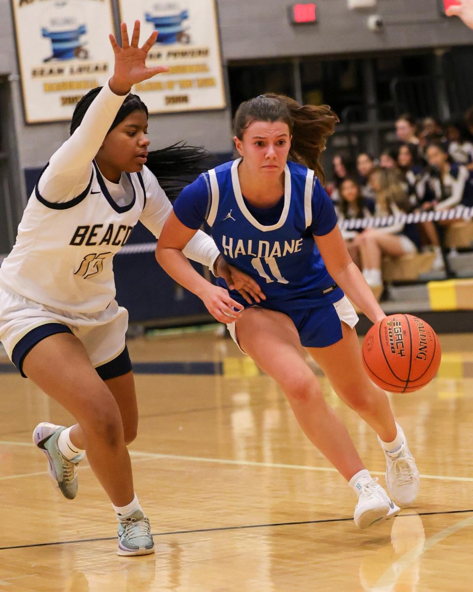 Junior Marisa Peters dribbles down the court during the annual Battle of the Tunnel game in Beacon on January 6. Peters led the varsity Blue Devils with 12 points but the team came up short with a 42-26 loss.