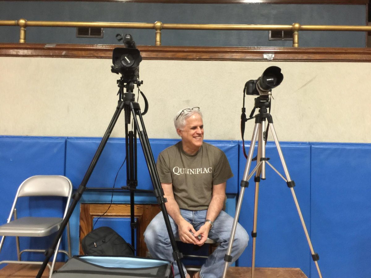 Jim Mechalakos takes a break in the Haldane auditorium. 