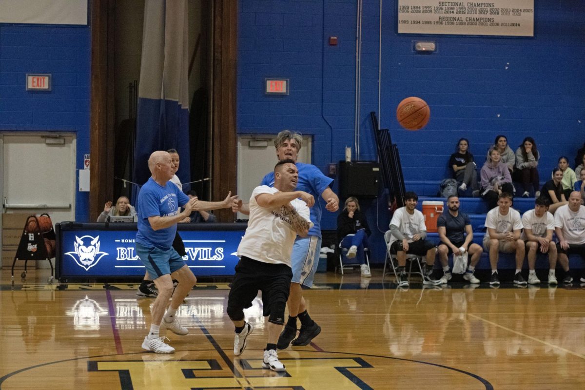 Jed Varrichio, Phil Cotennec, Tommy Wills and Fred Faust participate in Haldane's annual Alumni Basketball Game.