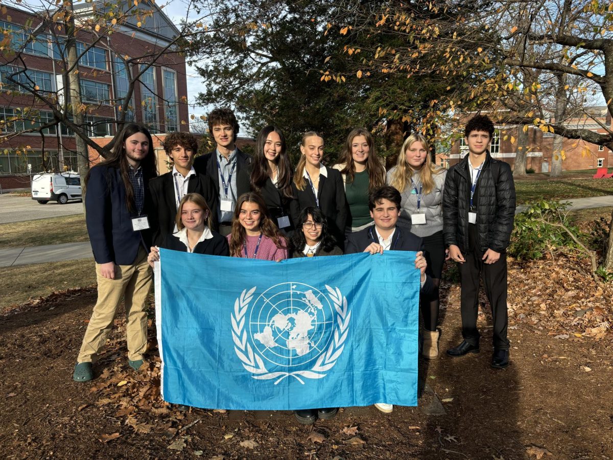 The model UN team gathers for a group photo at the UCMUN conference.