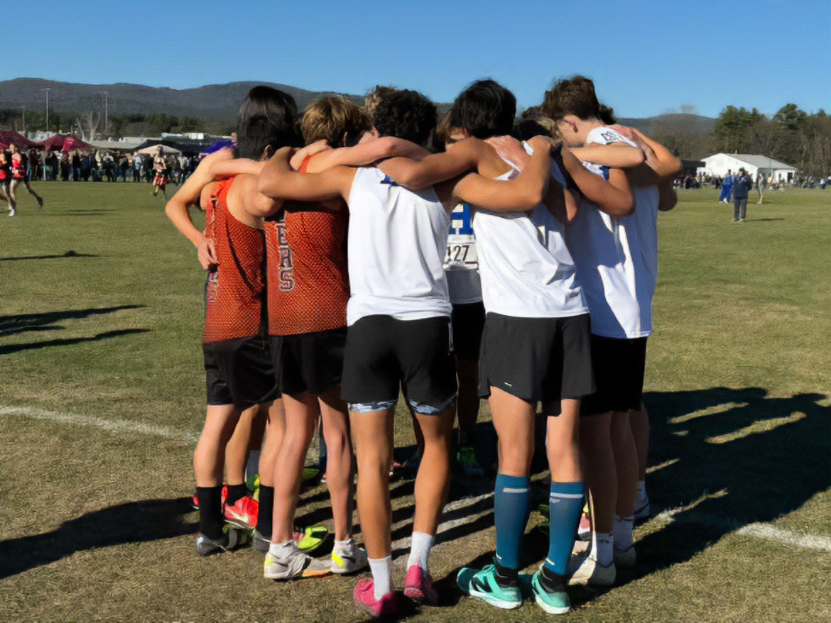 Haldane's cross-country team huddles up before state meet. 