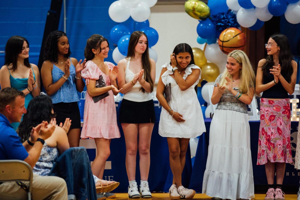 Freshman Mya Oliver, sophomores Amelia Nova-Martinez, Plum Severs and Ryan Duncan. junior Aine Duggan and freshman Charlie Robohm applaud junior Shayla Ochoa's State Pentathalon qualification acheivment at the Athletic Awards dinner on Wednesday June 4, 2025.