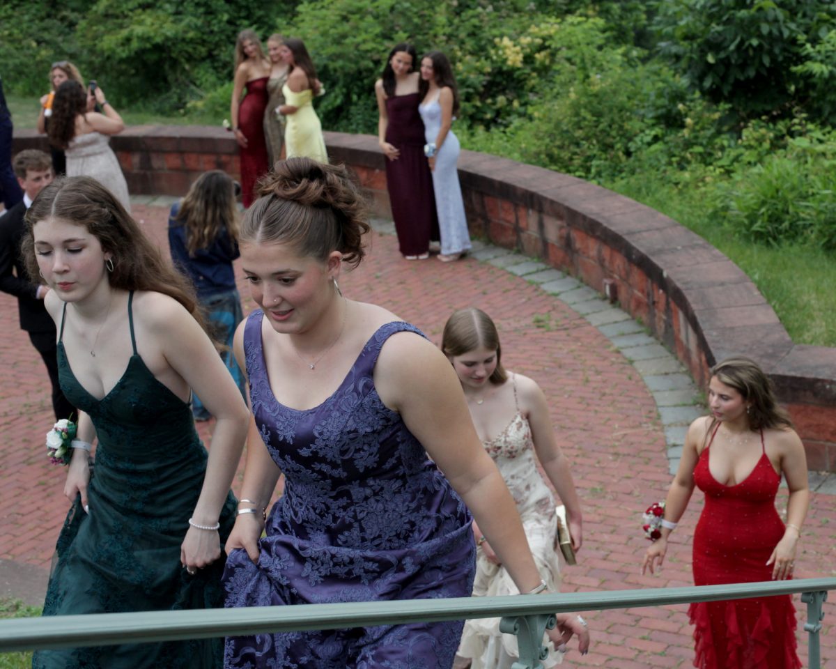 In their prom formalwear, Haldane seniors Claire Bolte, Caroline Sniffen, Kira Drury and Amelia Scarpino ascend the outdoor staircase during the traditional pre-dance class photos at Boscobel on Friday June 6, 2025.