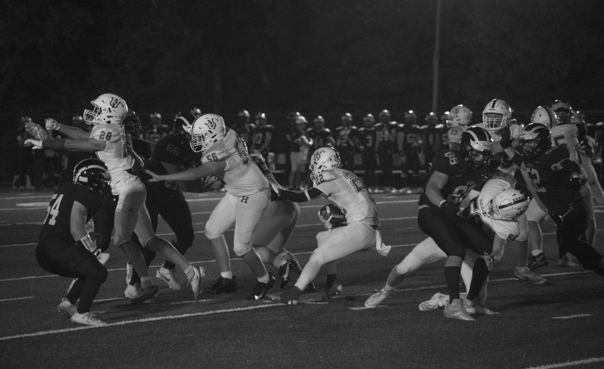 Haldane junior Alex Gaugler (22) pushes through a crowd of defenders to gain yards for Haldane during the Homecoming football
game on Friday, September 26, 2025.