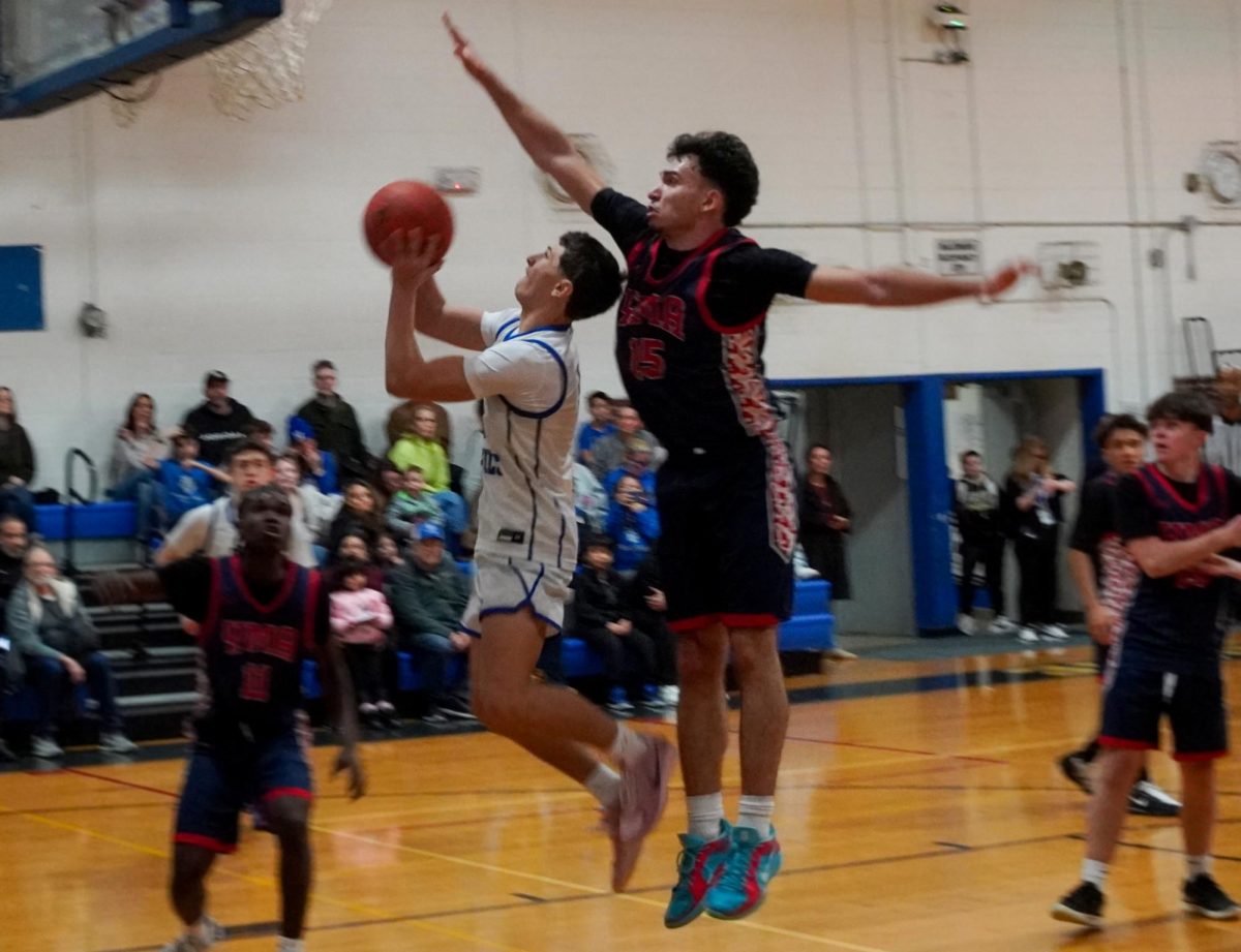 Junior David Powlis takes a contested layup during the Boy's Varsity Basketball home game against Yonkers Montessori Academy on Thursday January 15, 2026.