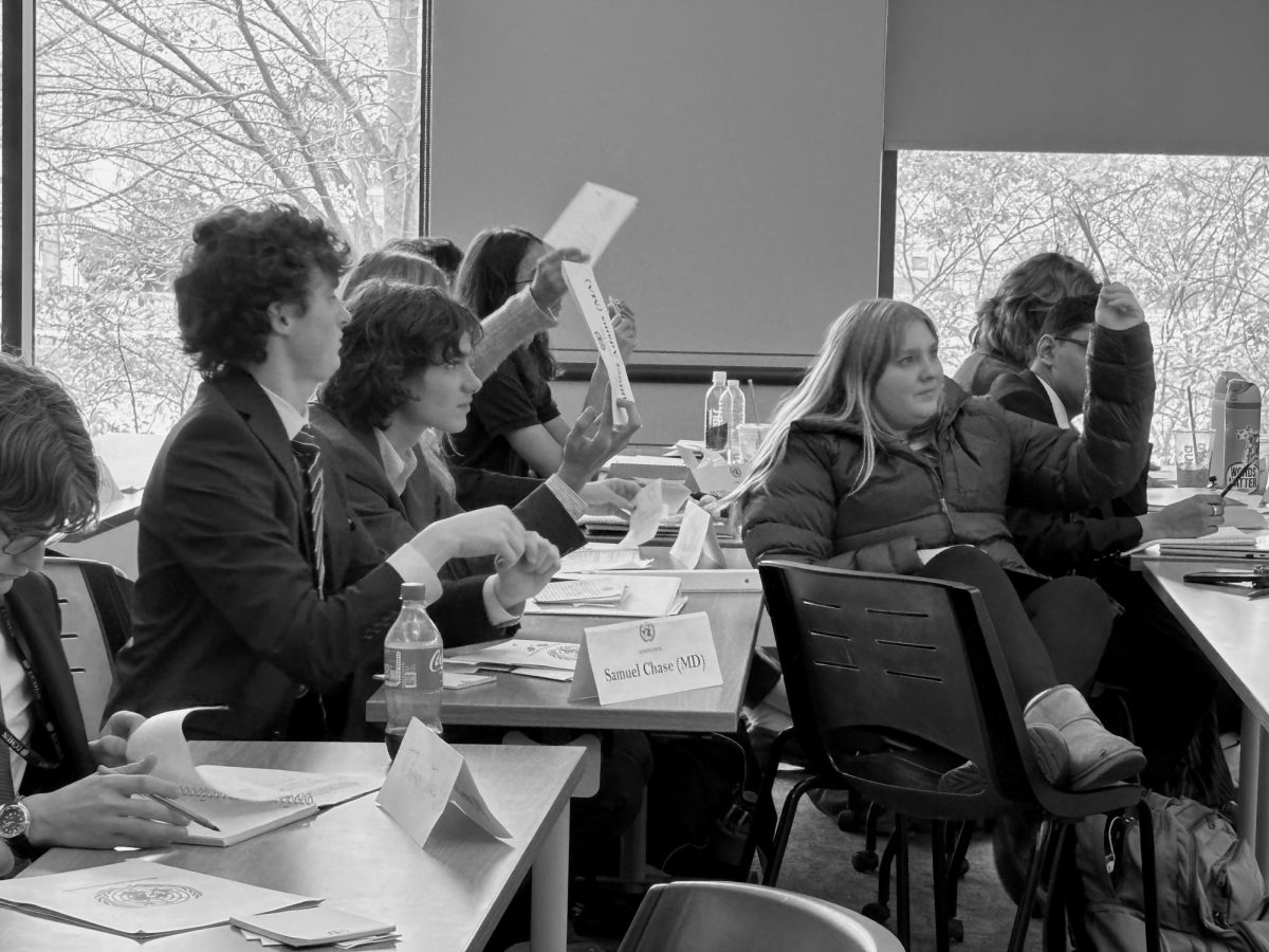 Seniors Henry Schimming and Dylan Ambrose participate in the 2025 Model United Nations conference at the University of Connecticut.