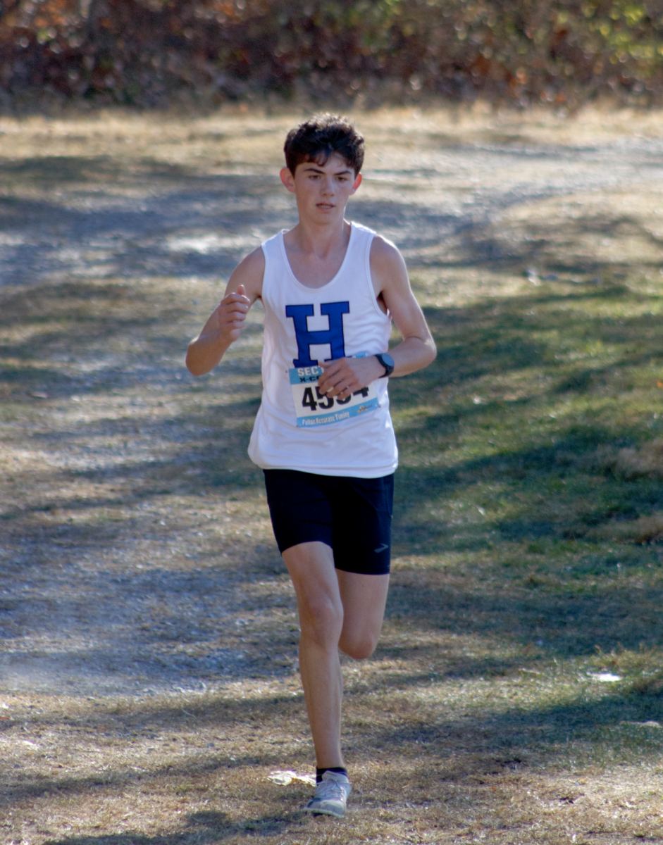 Senior Owen Powers keeps focused on his way to crossing the finish line after a long race.