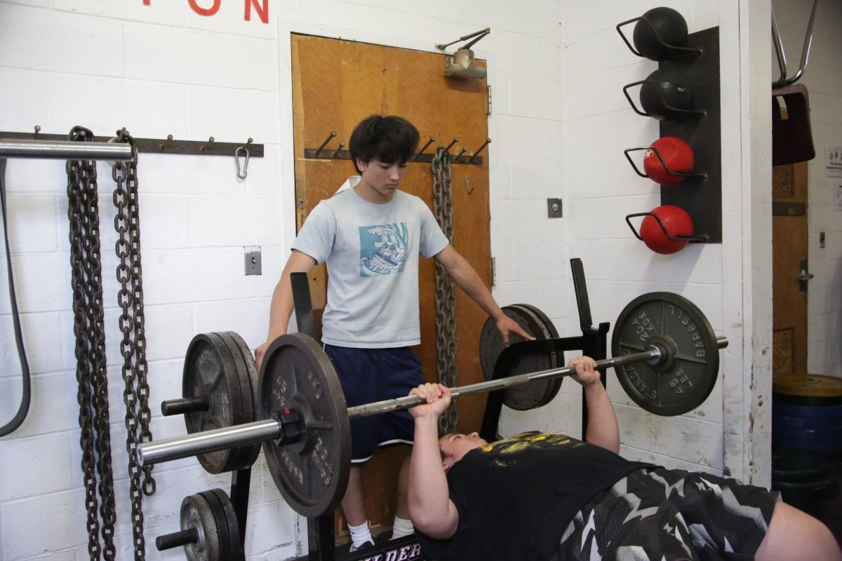 Freshman Sundance DiGiovanni spots his peer lifting rusty weights inside of the Haldane Middle School weight room on Monday, April 20, 2026.
