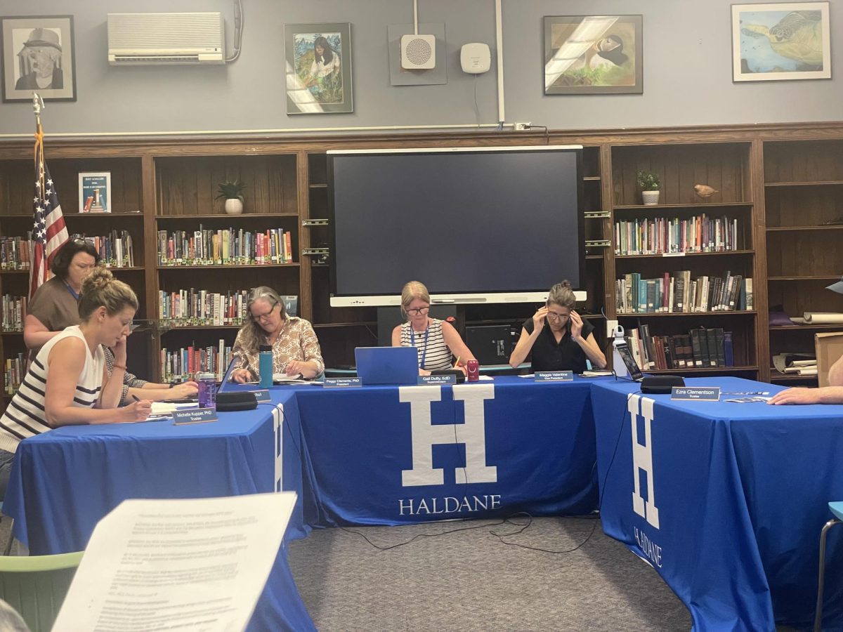 Members of the Haldane Board of Education accept the results of the Budget and Trustee Vote in the Middle School Library on Tuesday, May 19.