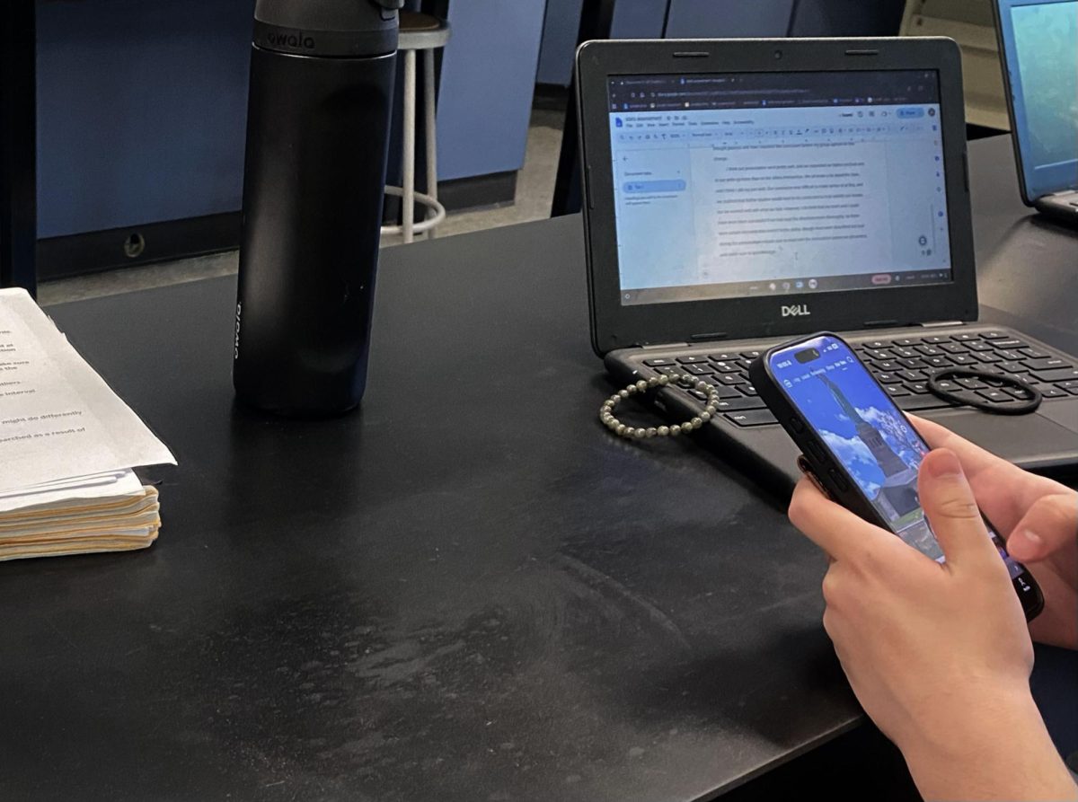 A Haldane High School student uses their phone during a class on Friday, June 5.
