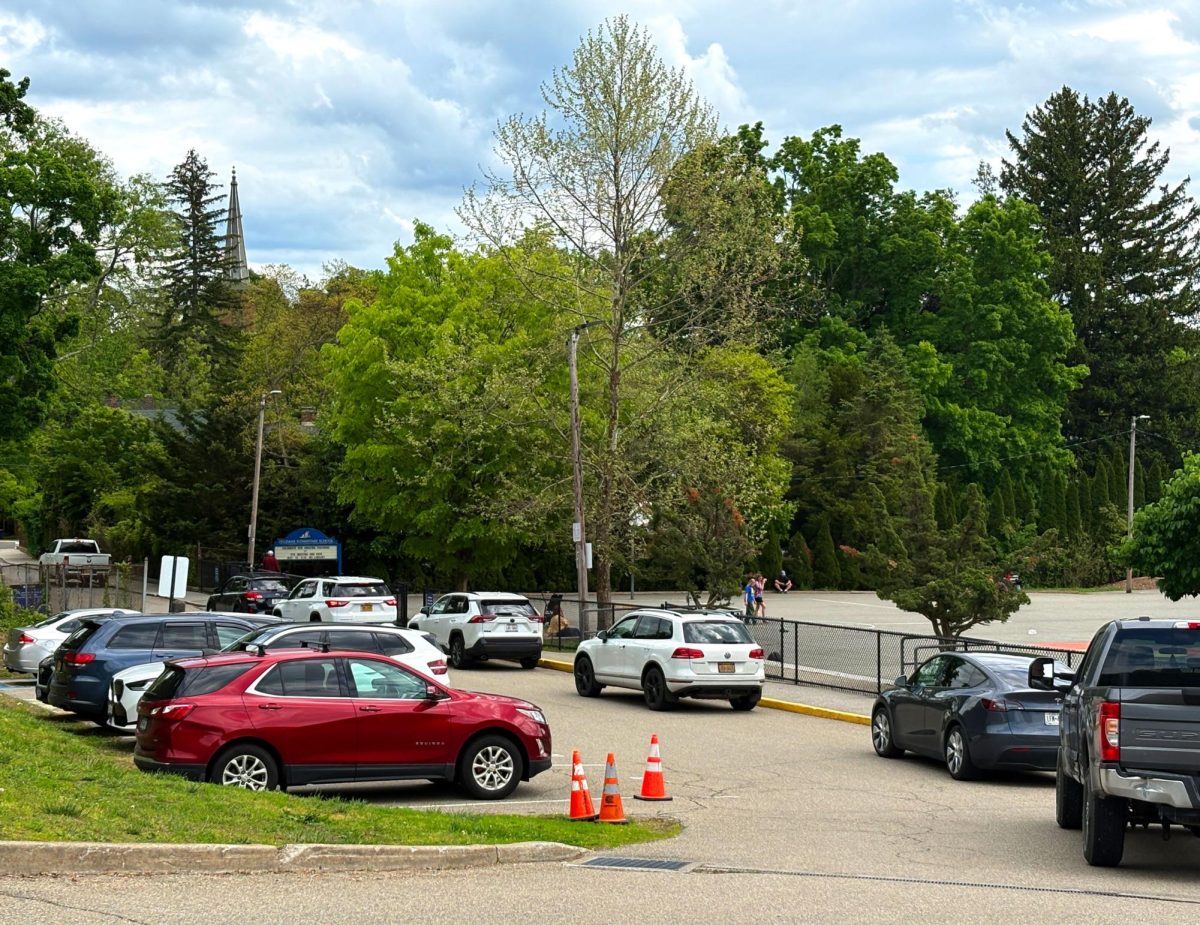 Haldane drivers line up in front of the Haldane playground ready to pick up their stu- dents on Th ursday, May 14, 2026.