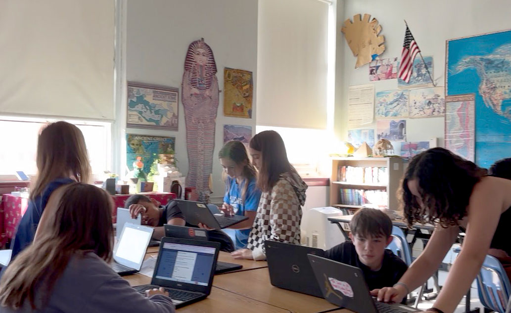 Haldane Middle School students work together on their final project in social studies teacher Jeff Sniffen's classroom on Friday, June 20, 2025.